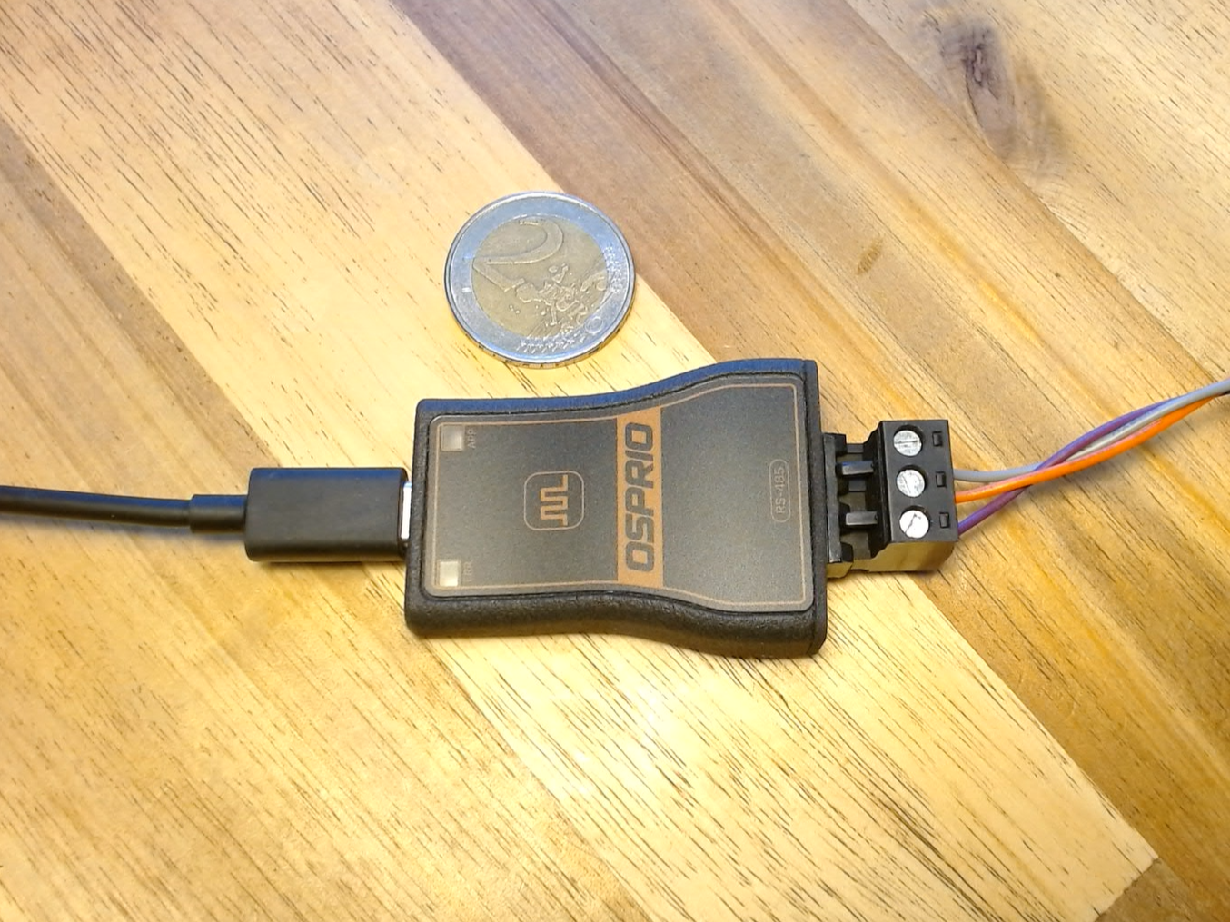 Osprio Mini next to a coin for size reference